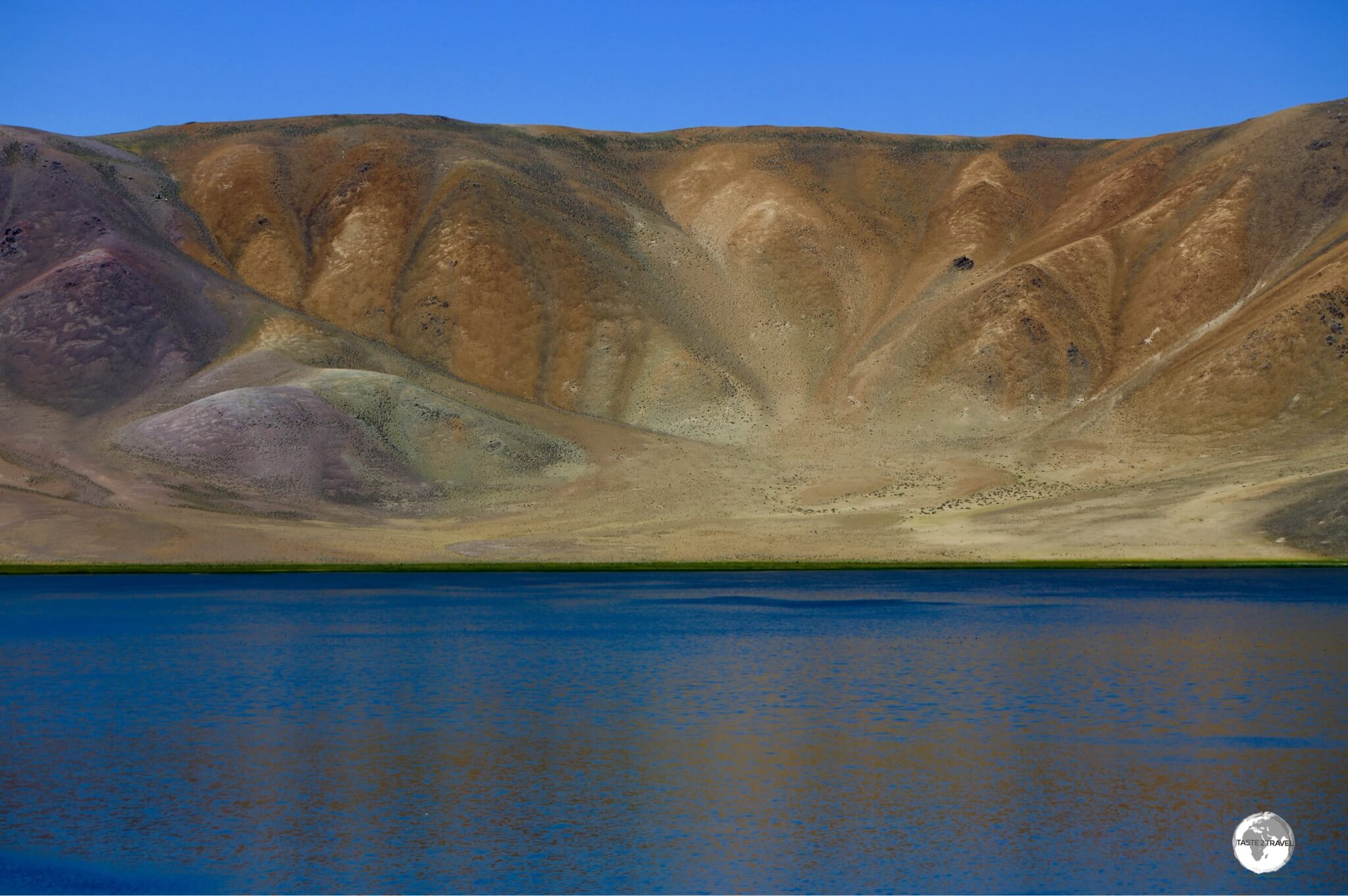 Reality or a painting? Different minerals provide a colourful backdrop to the very real Bulunkul lake.