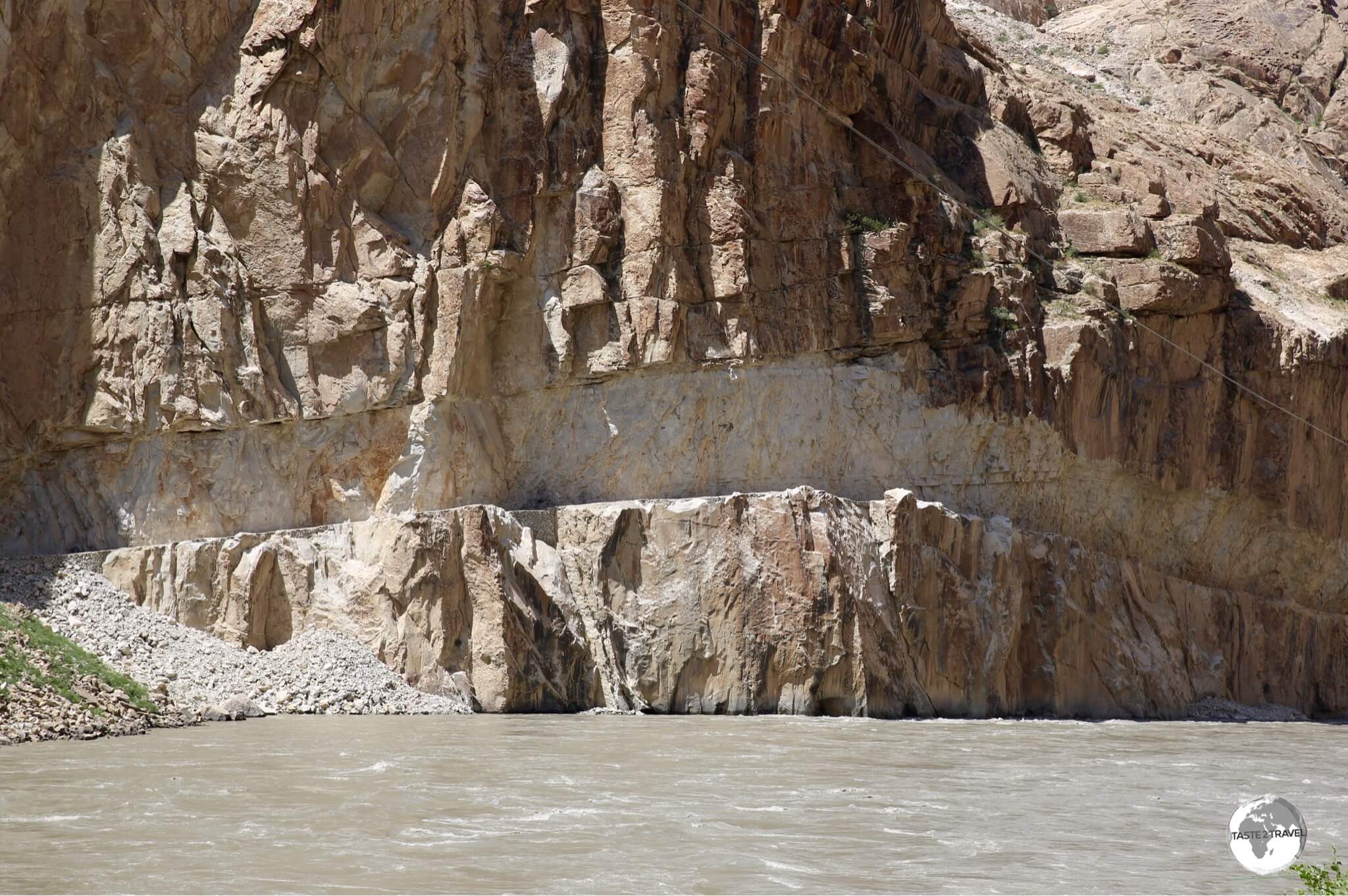 A road on the Afghanistan side of the Panj river which has been carved out of the cliff face. 