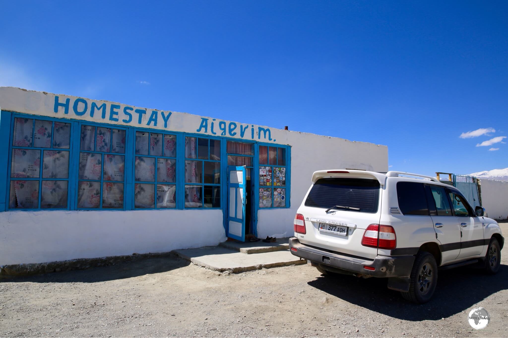 My driver checked us into the 'deluxe' digs at Homestay Aigerim on the shores of Lake Karakul.