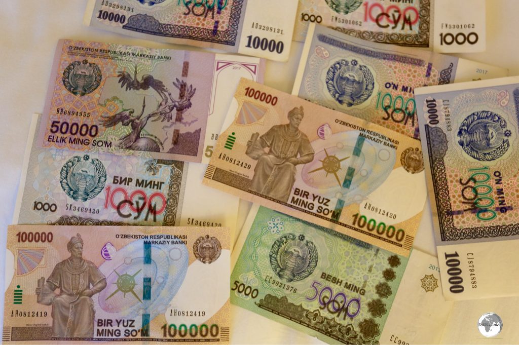 Uzbek som currency, showing the newly released 100,000 som note.