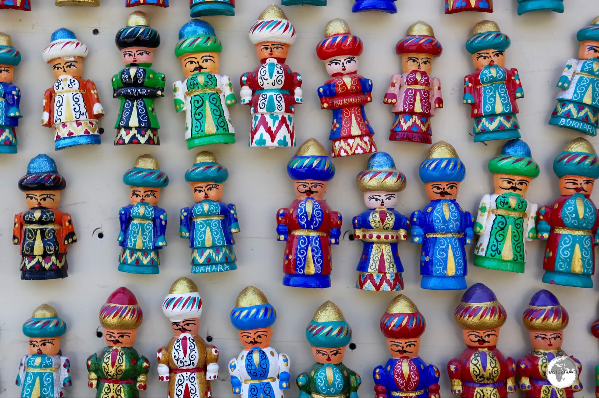 Uzbekistan Travel Guide: Hand-carved, wooden, souvenir fridge magnets for sale in Bukhara. 