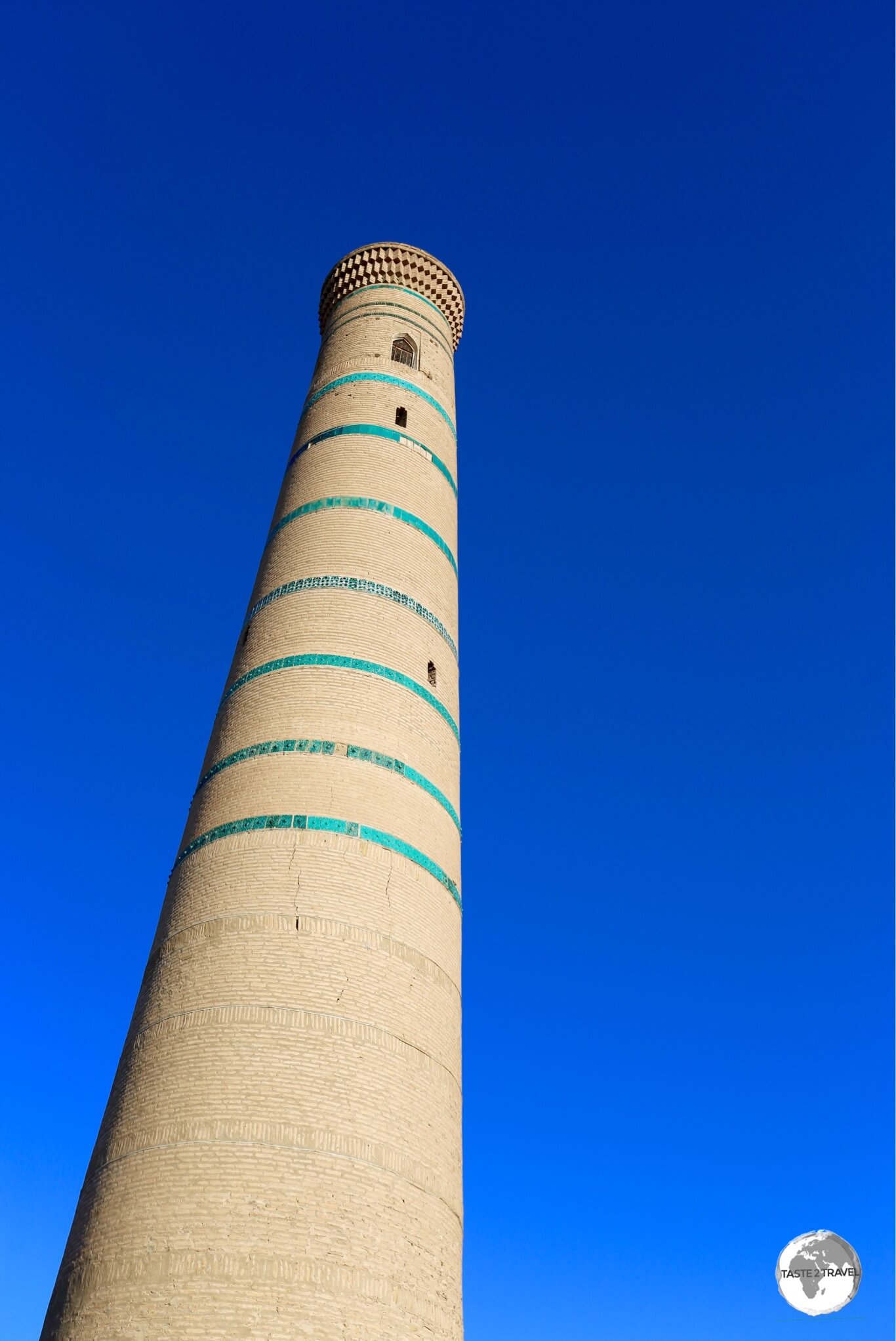 Easily distinguished by its turquoise-tile bands, the Juma Mosque minaret lies at the heart of Khiva old town.