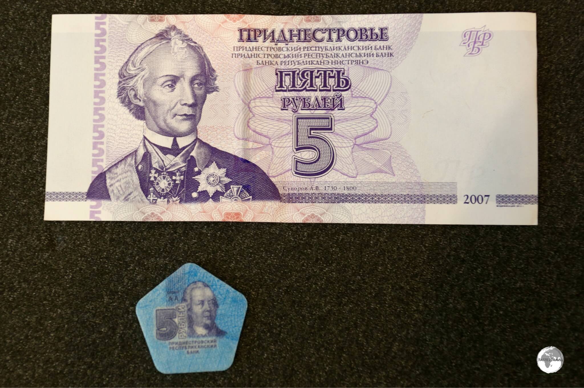 From the 'land of the quirky' comes the plastic 5 rouble token and the equivalent paper bank note.