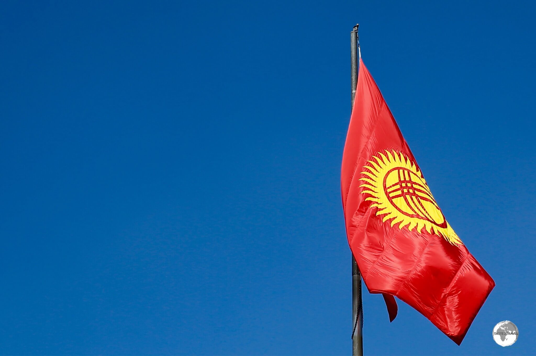 The flag of Kyrgyzstan, flying in Bishkek. 