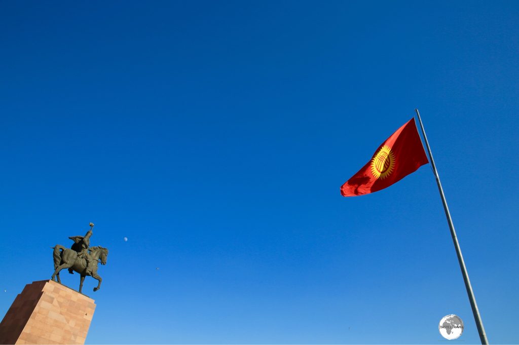 A statue of Manus and the, well-guarded, flagpole on Ala-too square in Bishkek.