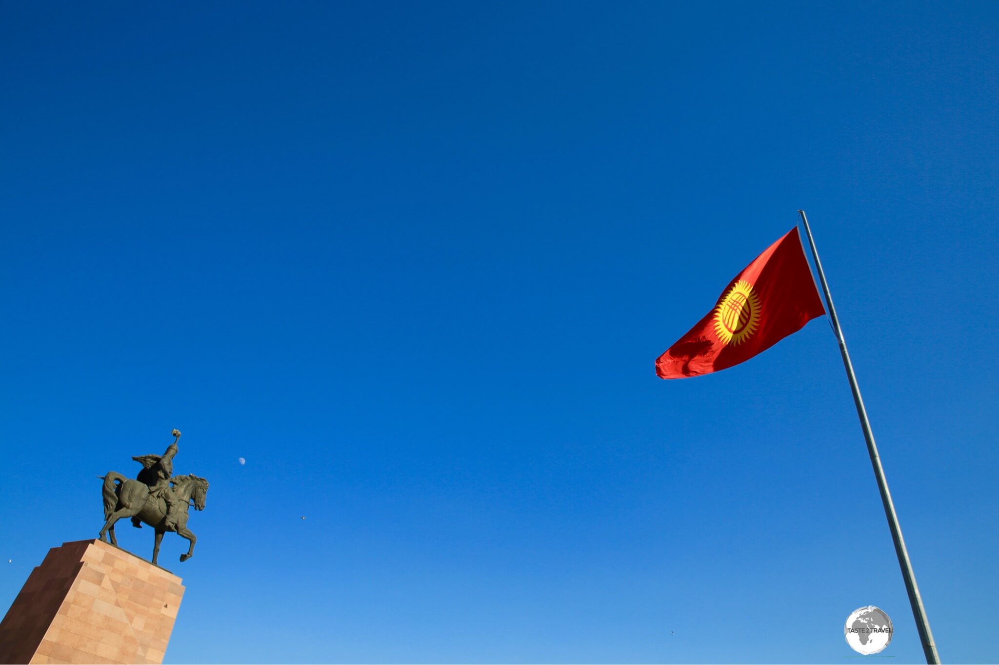 A statue of Manus and the, well-guarded, flagpole on Ala-too square in Bishkek. 