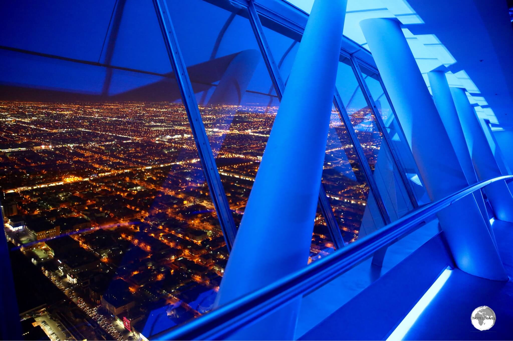 A night time view of Riyadh from a very 'blue' Sky bridge at Kingdom Centre.