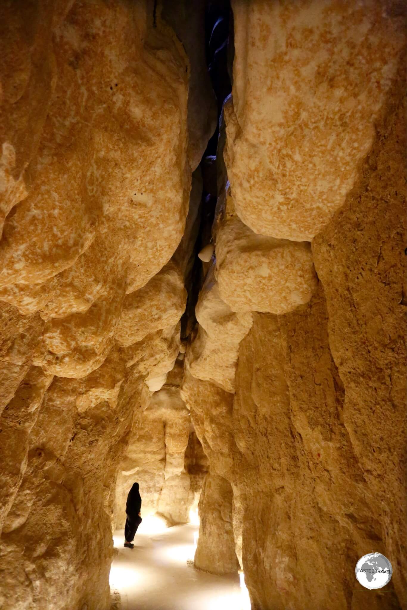 A Saudi visitor inside one of the caverns of Al Qarah Mountain.