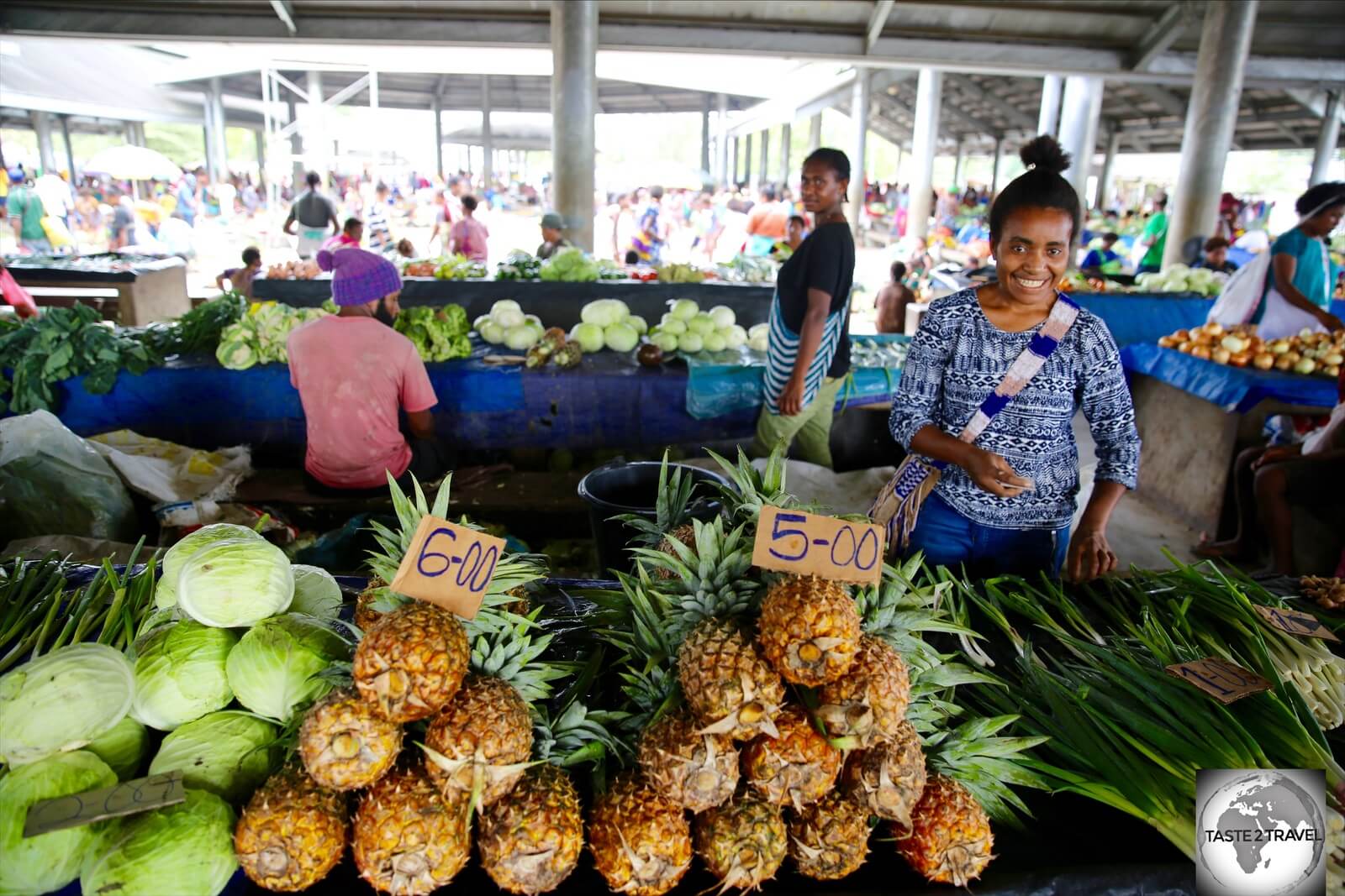 Juicy and sweet, pineapples at Madang market cost just K5 (USD$1.47).