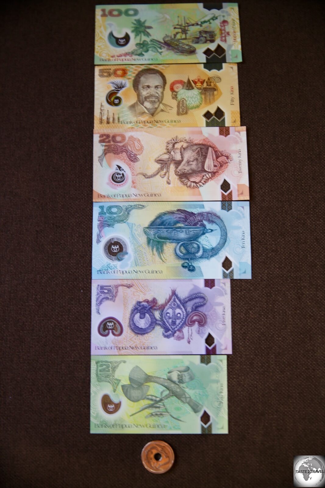 The complete Kina bank note series (reverse side), including the K1 coin. 