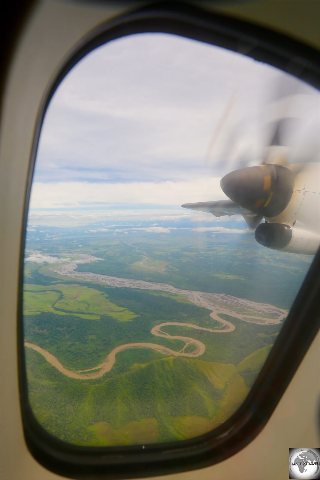 The view from my PNG Air Flight from Madang to Lae. Due to the rugged terrain and a lack of infrastructure, most places are accessed by air.