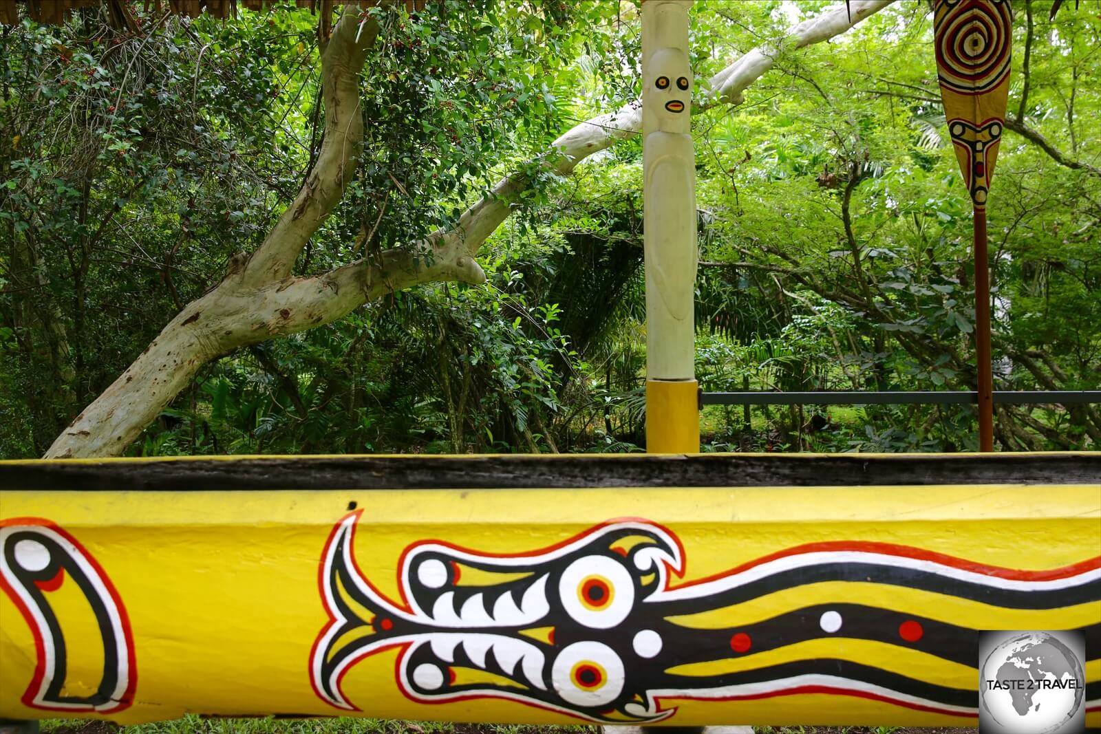 A colourful, hand-carved, wooden canoe at the POM Nature Park. 