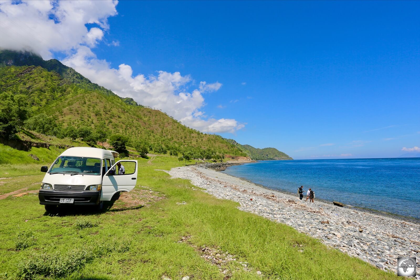 A view of the Dive Timor van parked on the beach at the very remote 'Dirt Track' dive site.