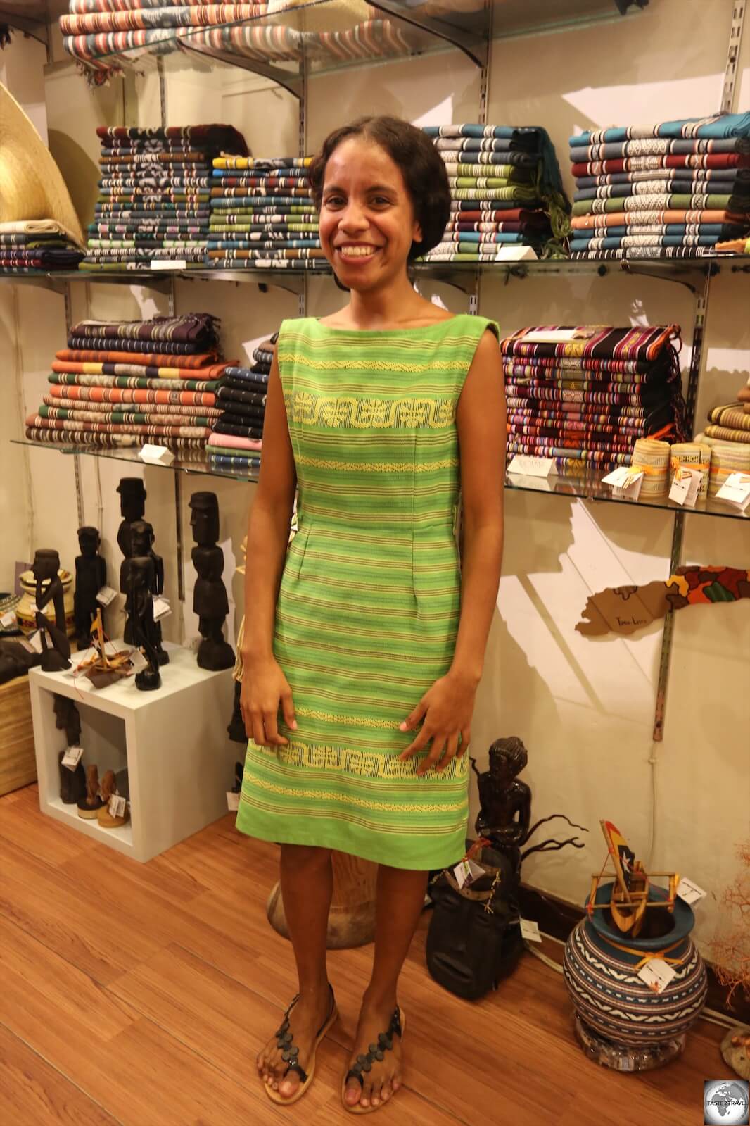 Ana, one of the friendly staff members at Things and Stories boutique, modelling a beautiful dress made from Timorese Tais cloth.