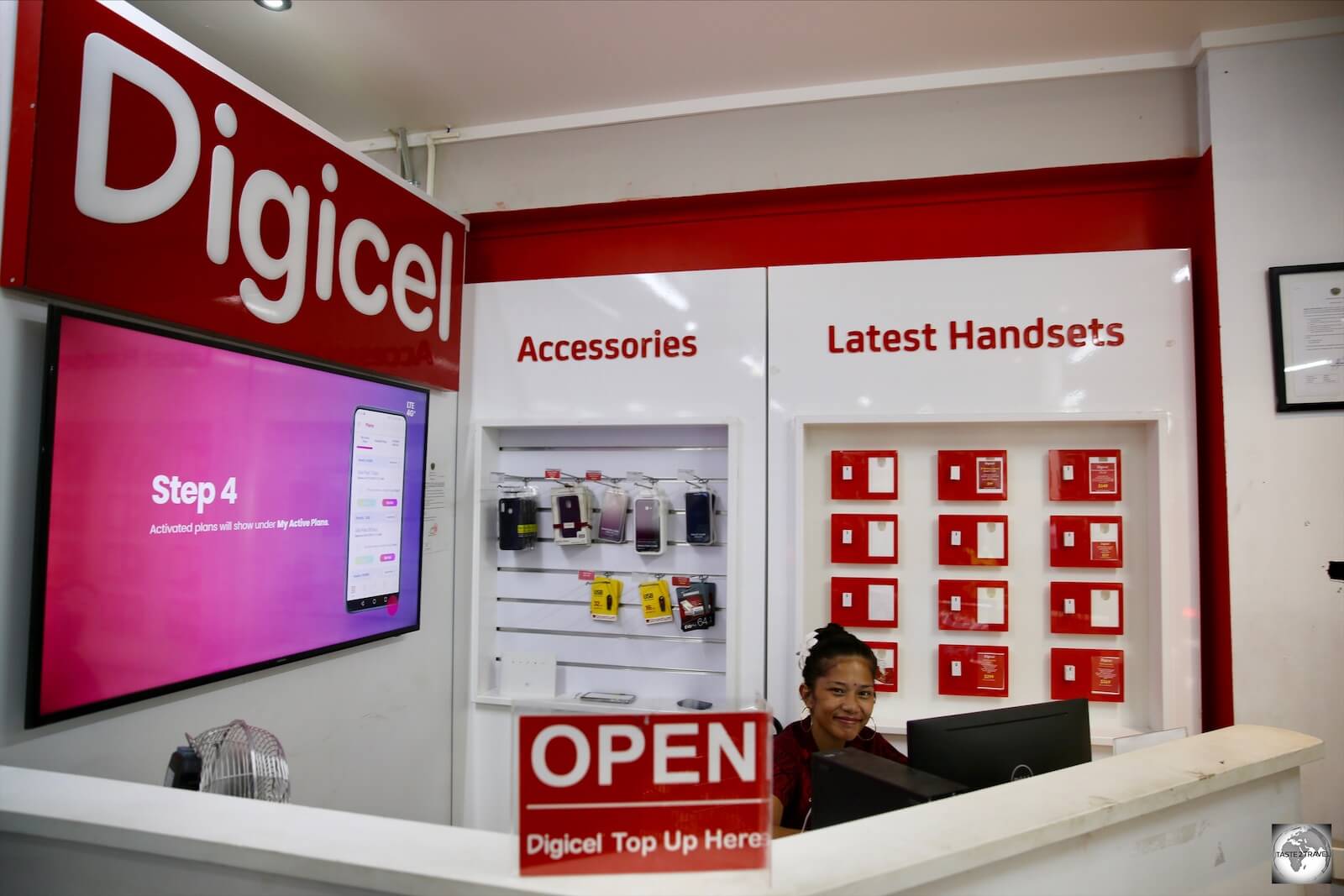 A friendly Digicel staff member at the Digicel kiosk at Capelle and Partners.