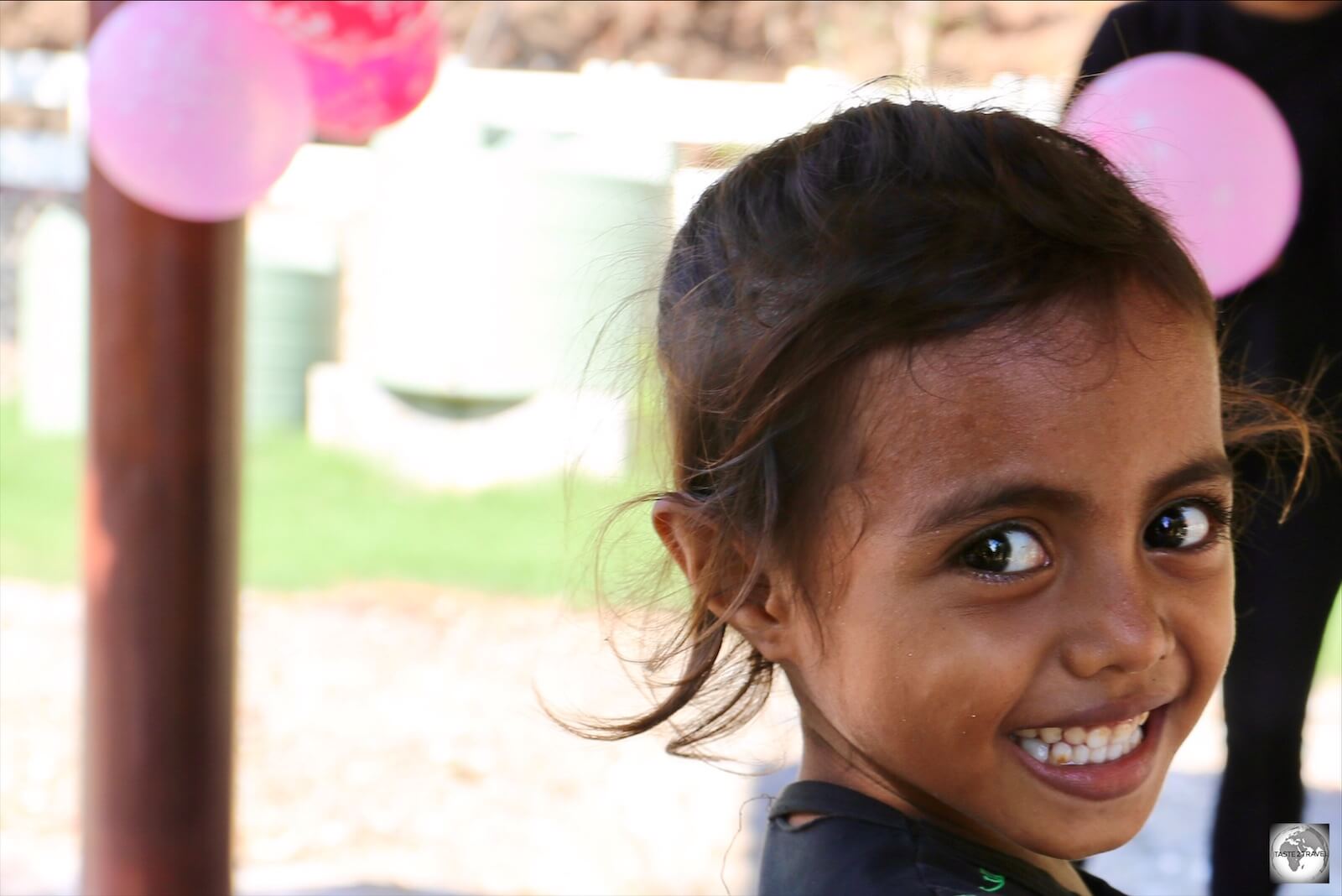 A young Timorese girl attending a birthday party at Cristo Rei in Dili. 