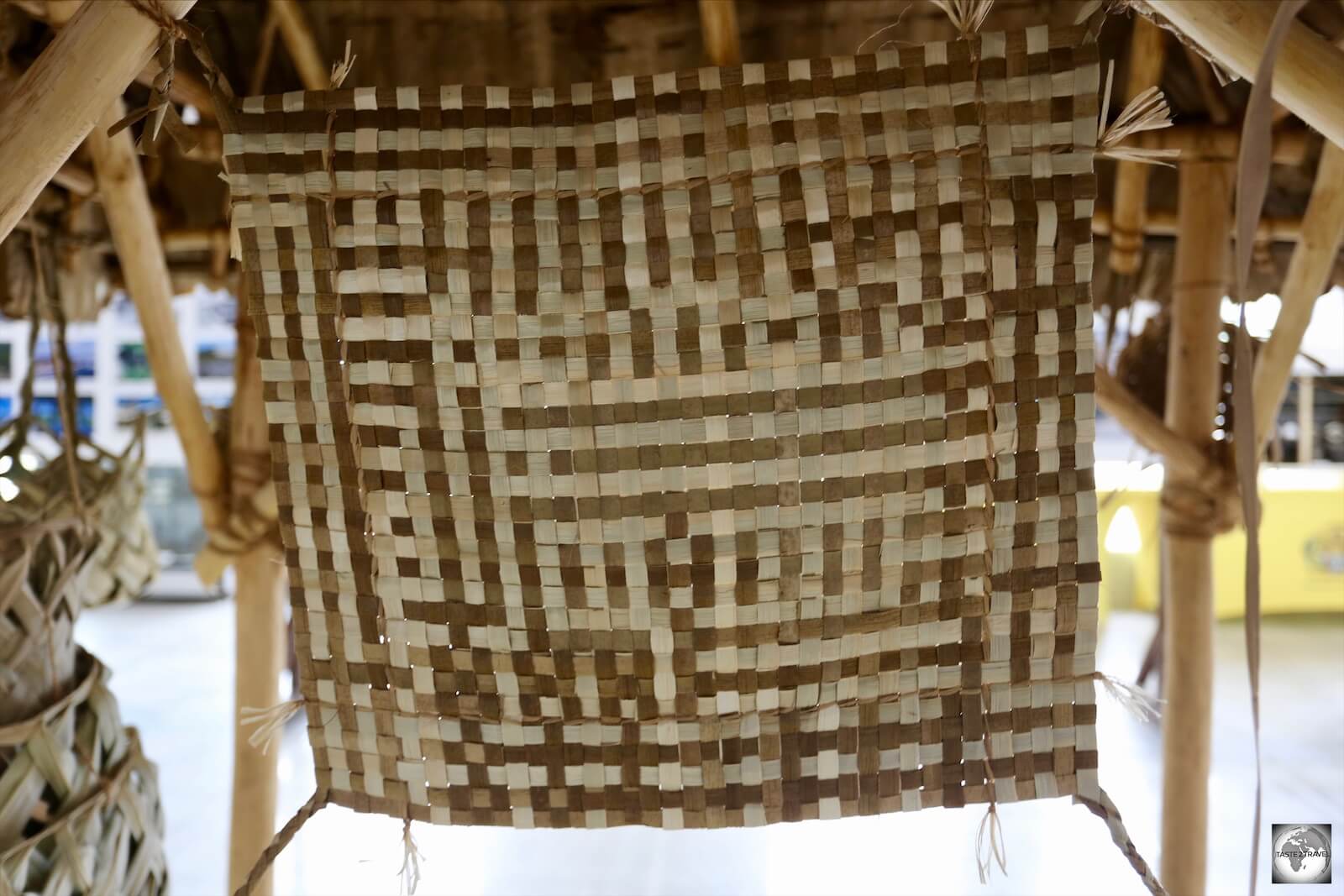 A close-up view of a traditional 'Tribal Mat'. About the size of a place-mat, these were worn around the waist by woman with the distinct pattern indicating their tribe. 