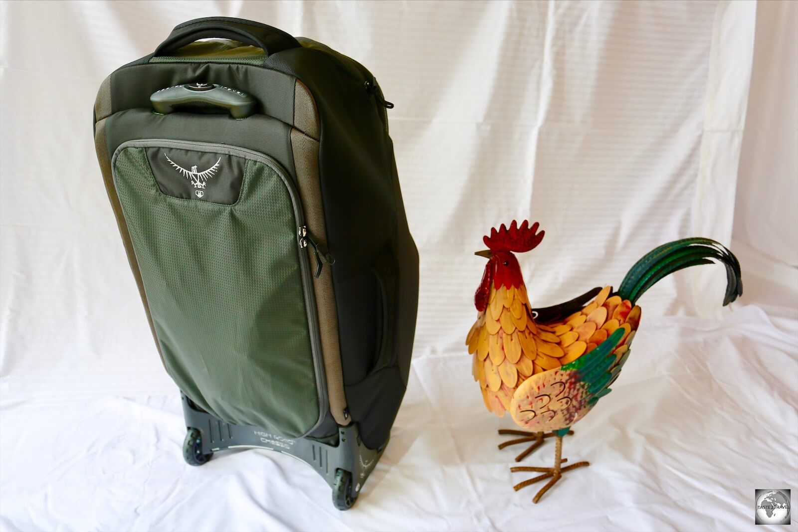 A rear view of the Osprey Sojourn 80, showing the durable, but comfortable handle and the shoulder harness compartment.