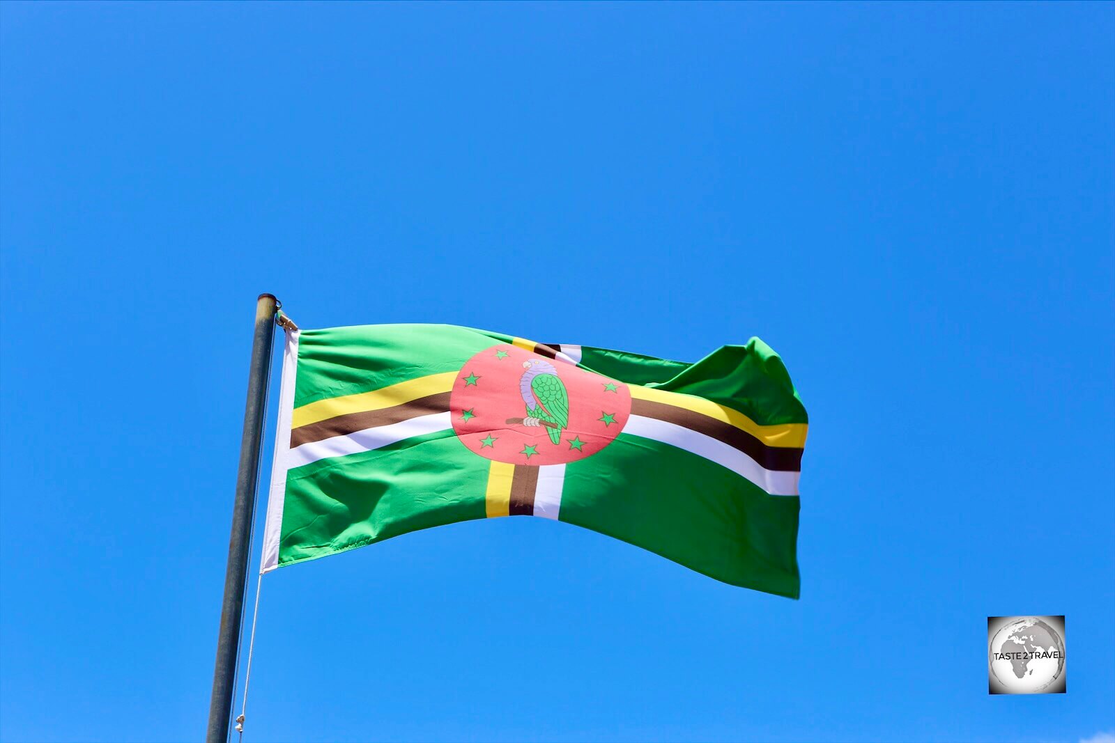 The flag of Dominica flying in Roseau.