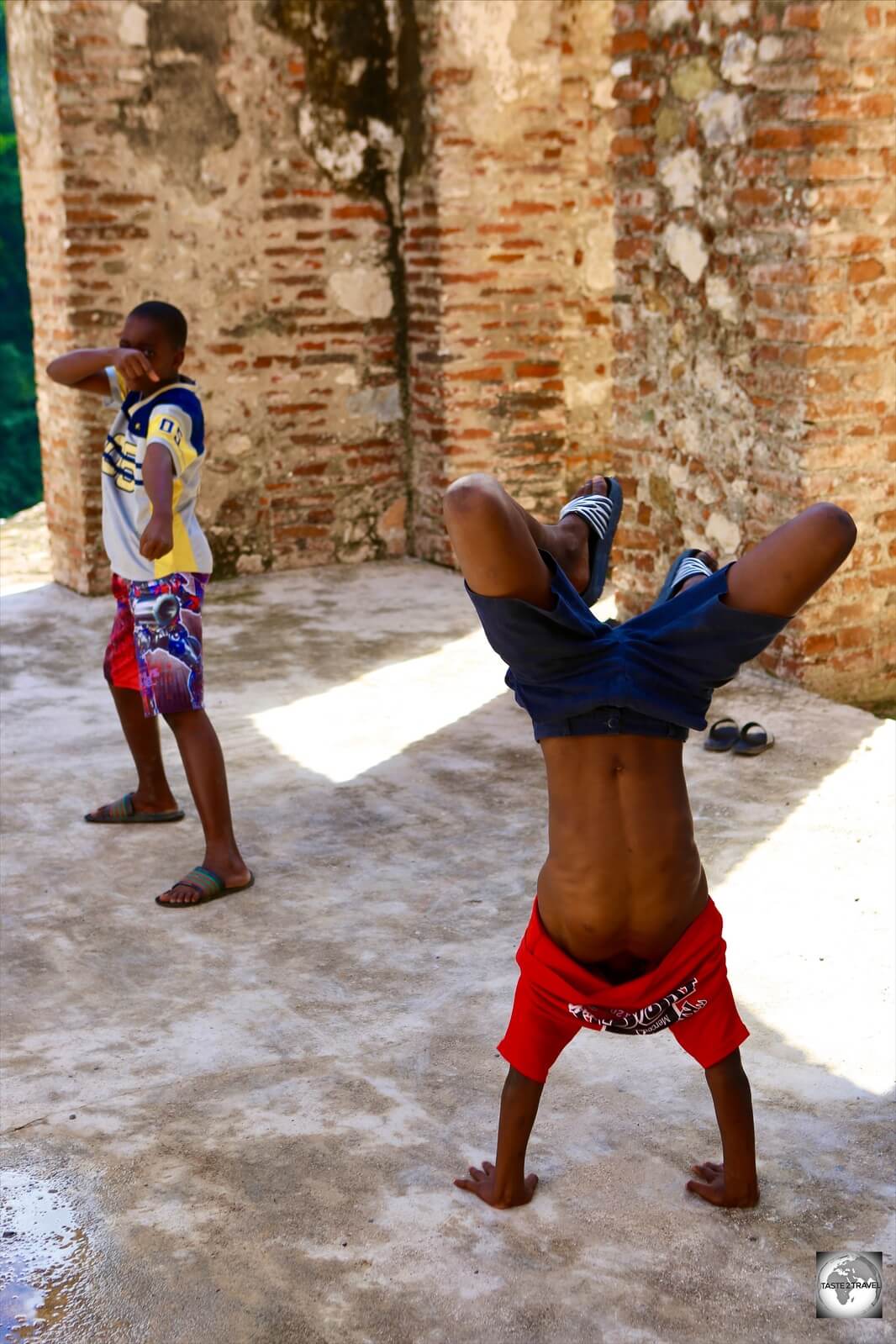 Local boys playing among the ruins of Sans Souci Palace.