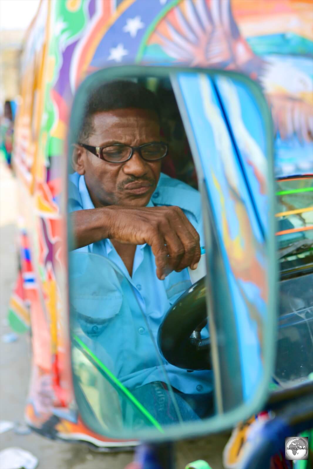 A 'Tap-Tap' (public minivan) driver in downtown PAP.