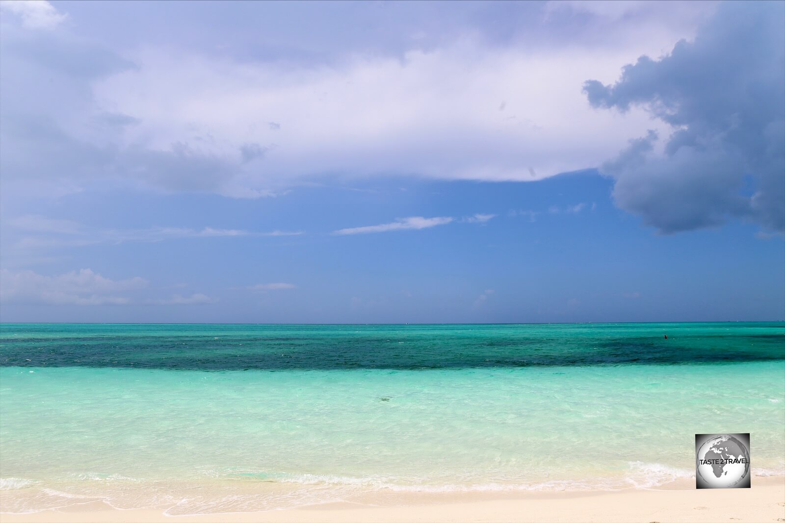 A raised limestone shelf, Provo island is surrounded by pristine turquoise water.