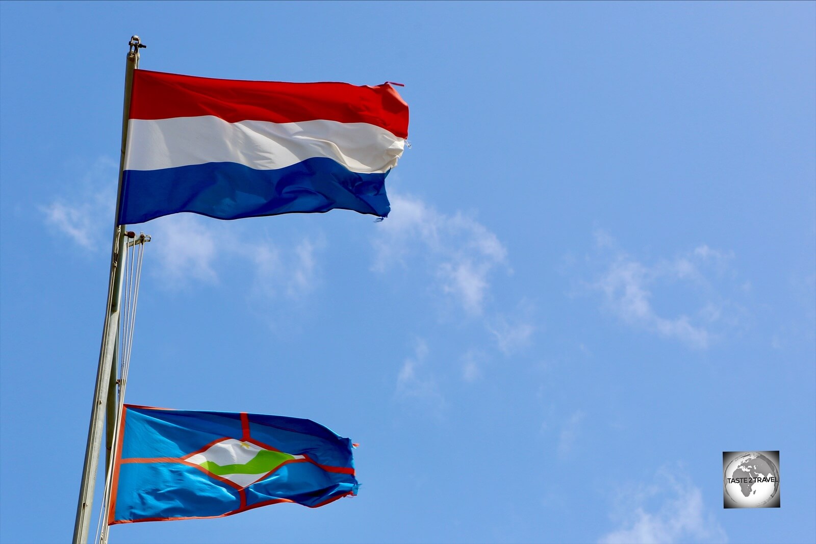 The flag of Statia flying alongside the Dutch flag.