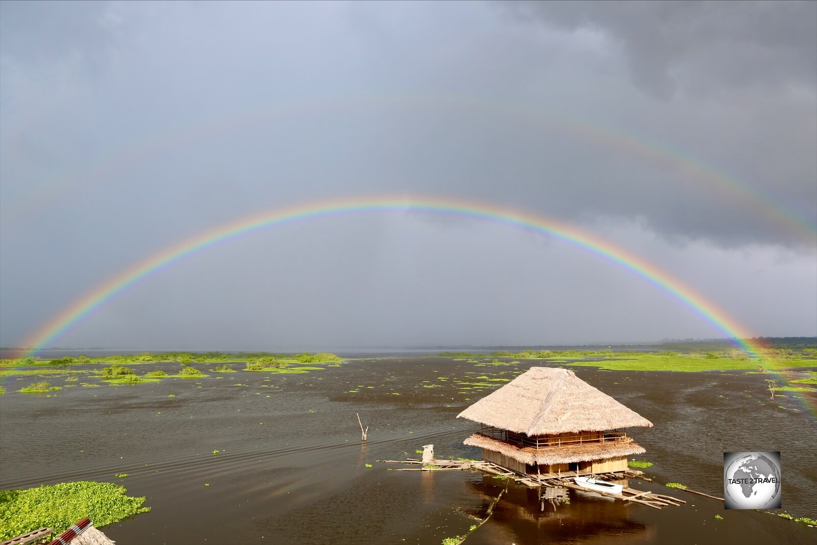 A rainbow forms over the Amazon river at Iquitos.