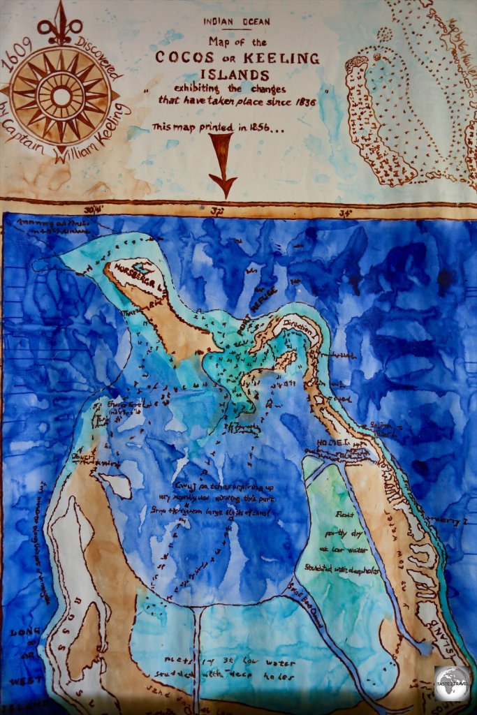 A hand-painted map of the Cocos (Keeling) Islands, showing the circular shape of the barrier islands.