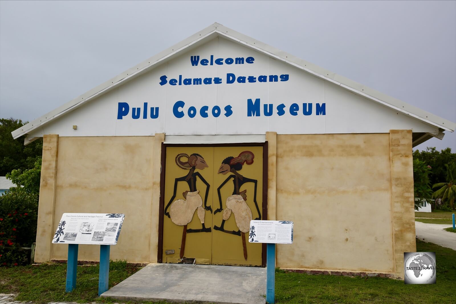 <i>Wayang Kulit</i> puppets adorn the doors of the <i>Pulu Cocos Museum</i> on Home Island Museum. 