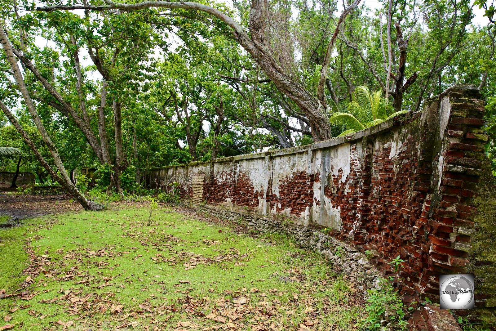 The crumbling brick walls which surround the Clunies-Ross estate on Home Island. 