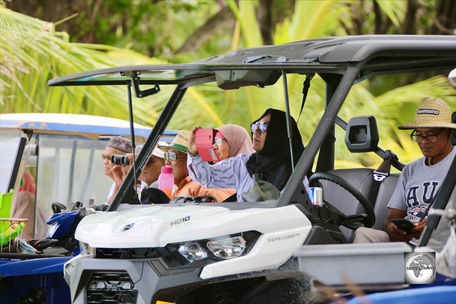 Cocos Malay locals on Home Island, watching the Jukong race from the comfort of their buggies.