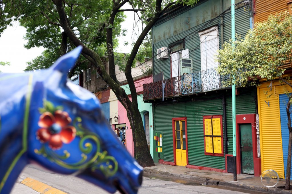 The former working-class 'La Boca' neighbourhood of Buenos Aires is characterised by brightly painted corrugated iron shacks that evoke the district’s early immigrant days.