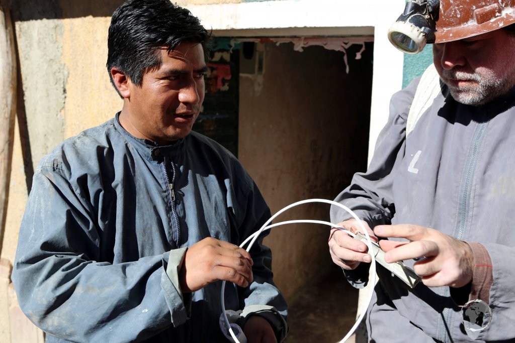 Preparing for our tour of the Cerro Rico silver mine, our tour guide (left) purchases dynamite at a supply store in Potosi, which would be detonated while we are deep underground.