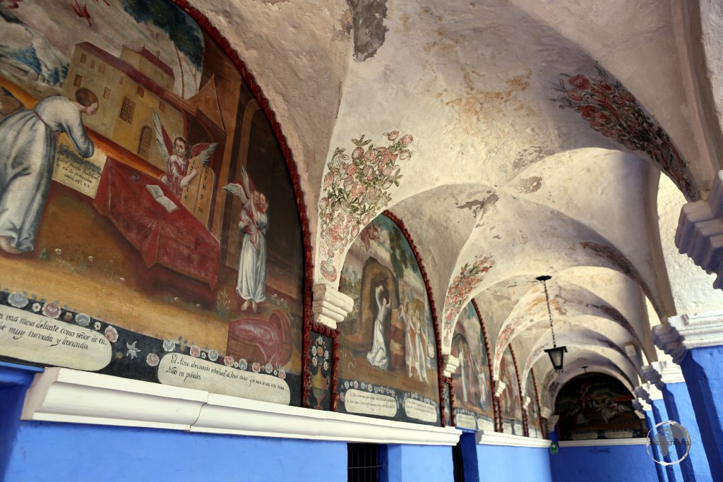 Religious paintings line one of the many cloisters, which lie inside the high stone walls of the Convent of Santa Catalina de Siena in Arequipa.