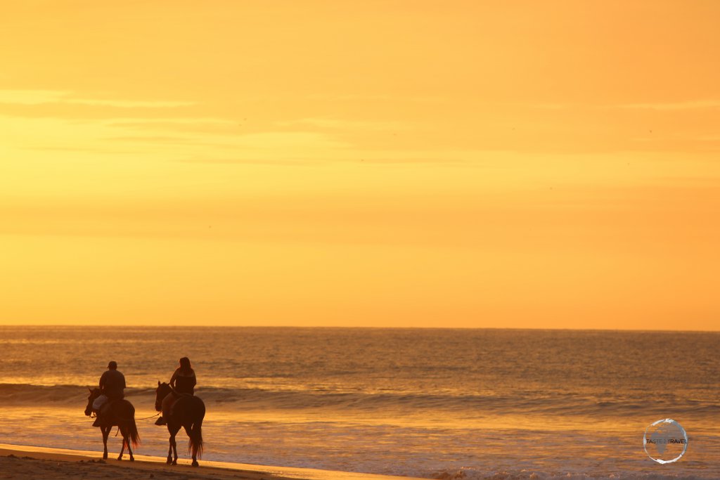 Riding into the sunset at Máncora beach, northern Peru.