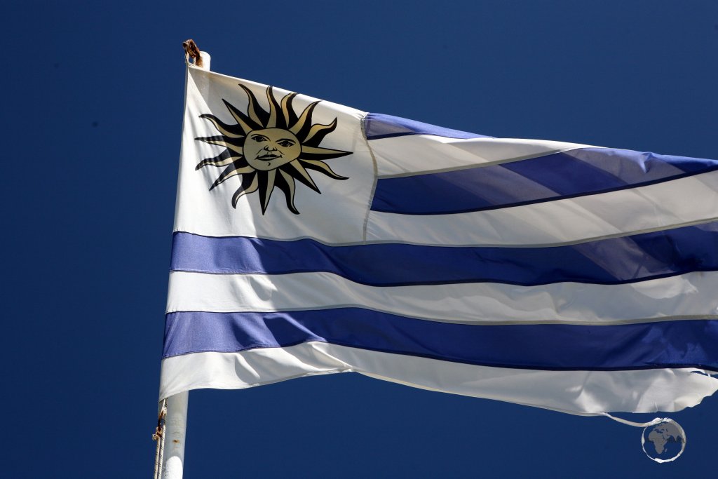 The flag of Uruguay, flying at the Cabo Santa Maria Lighthouse in La Paloma.