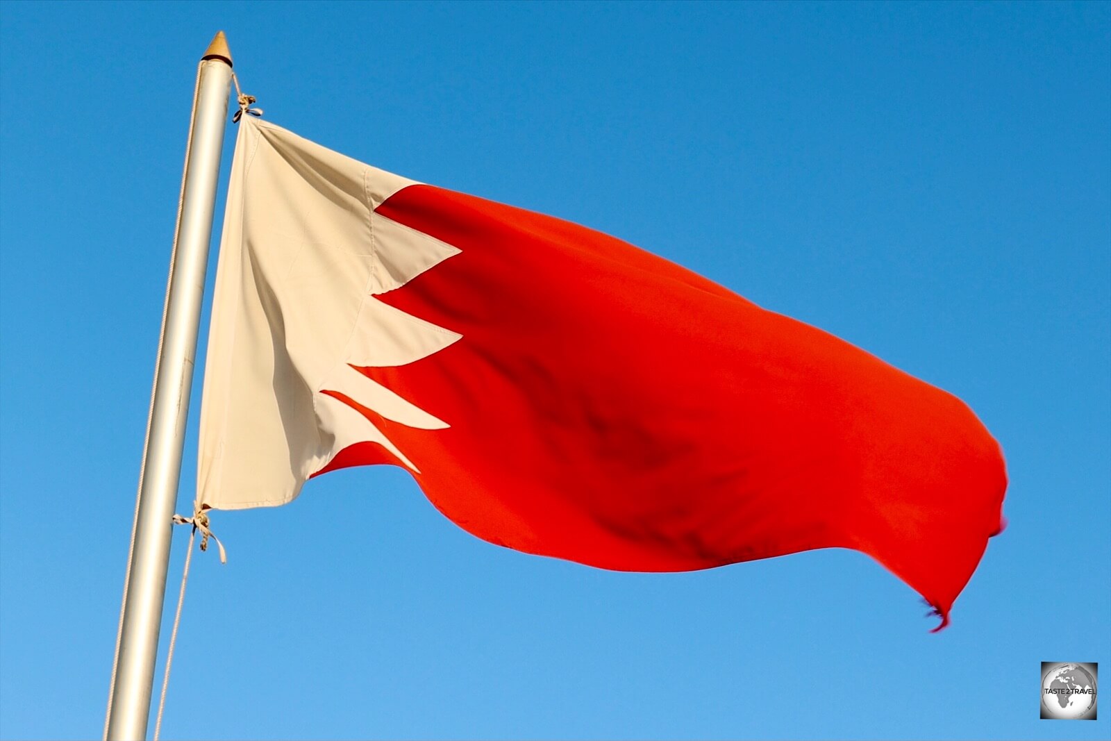 The flag of Bahrain, which is very similar in design to the flag of neighbouring Qatar. 