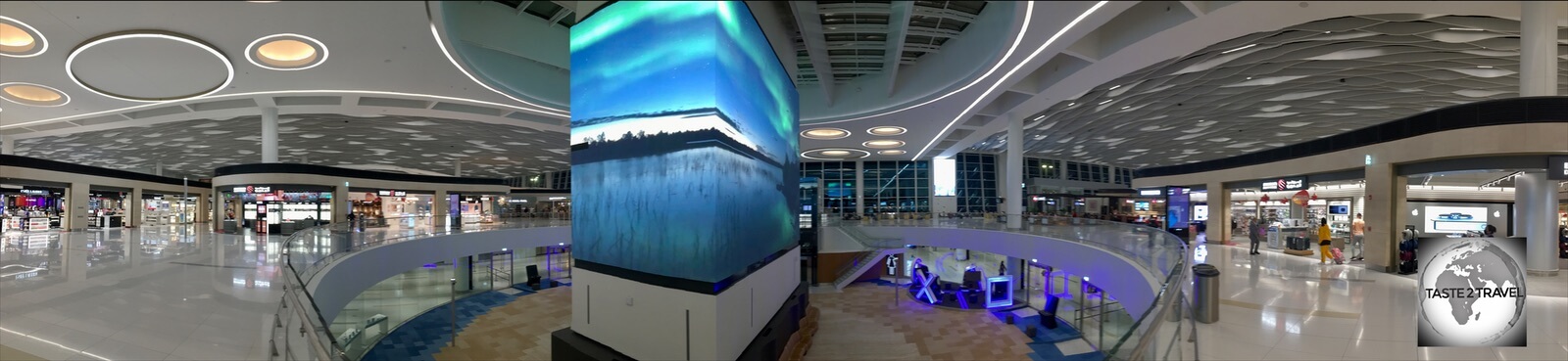 A large LED screen in the centre of Bahrain International Airport screens 'Bahrain Moments'.