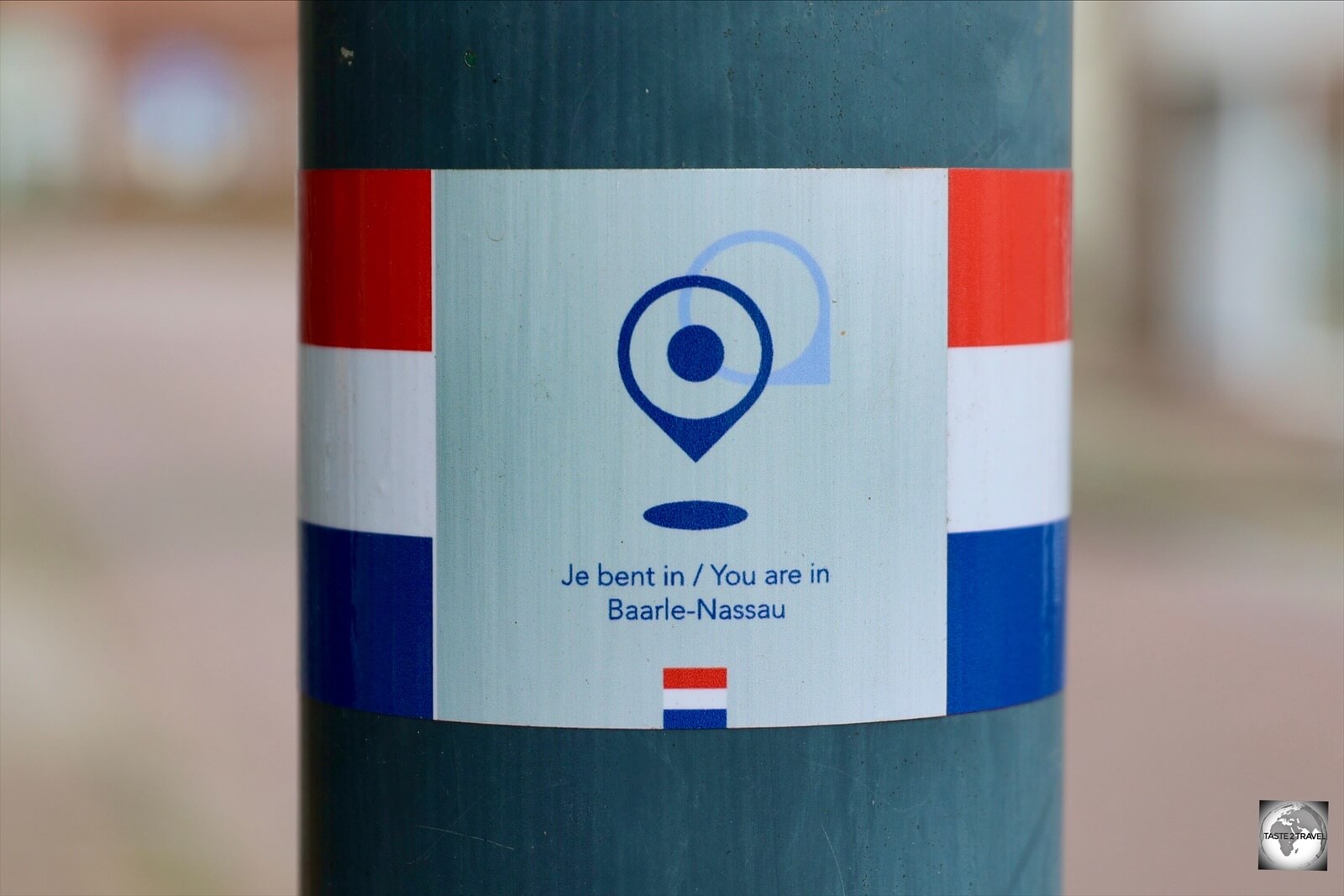 While walking around Baarle, helpful markers on each light pole indicate which country you are in. 