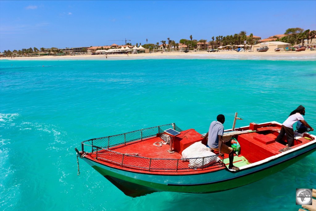 Fishermen in Santa Maria, with the town beach and Hotel Morabeza in the background.