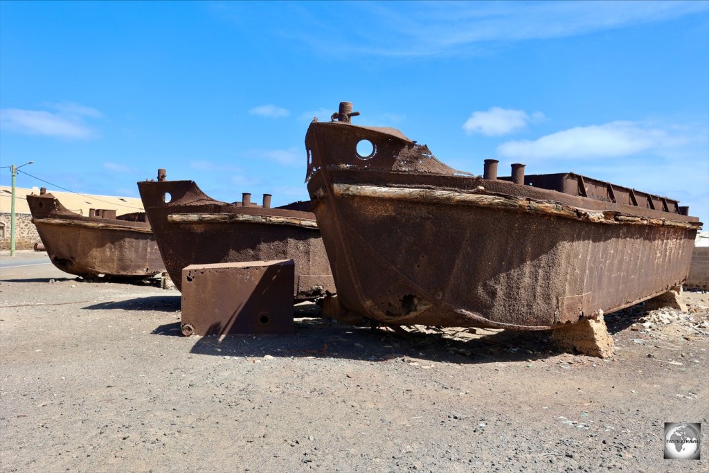 The rusted hulks of former salt barges lies on the beach in Pedra de Lume.