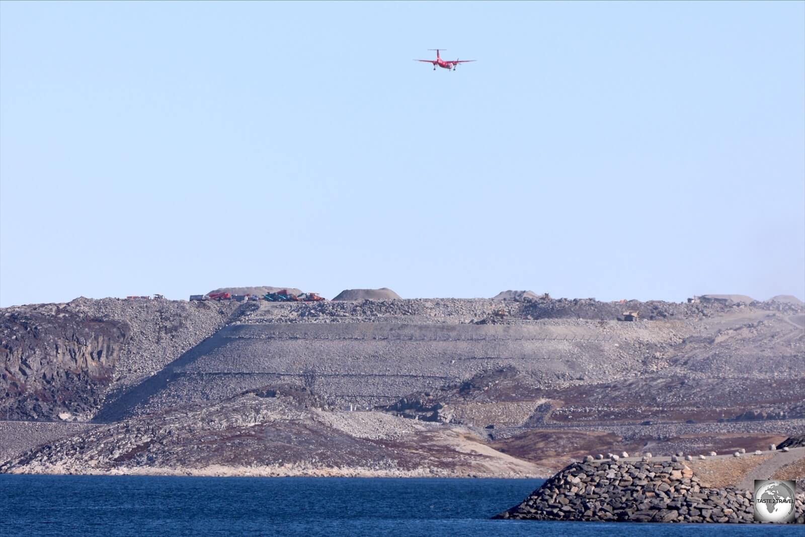 Moving mountains - a view of the huge earthworks program which supports the extended runway at Nuuk airport.