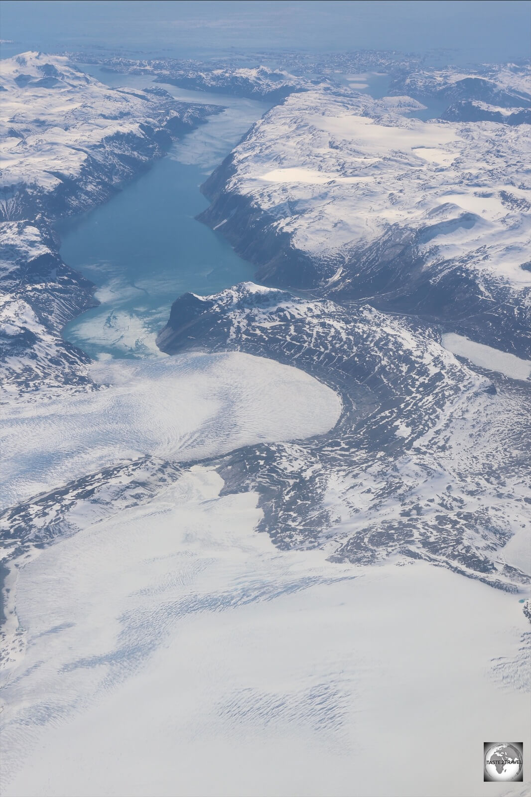 The Greenland Ice Sheet is drained along the coast by many massive glaciers.