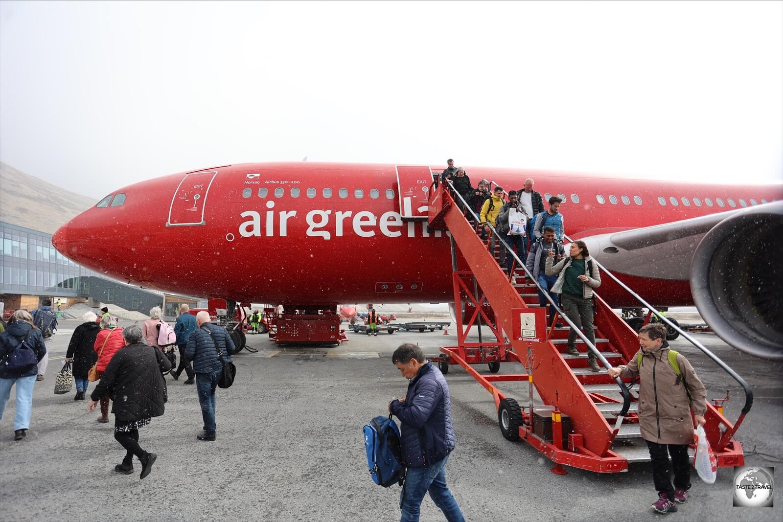 Arriving passengers are greeted by a snow storm at Kangerlussuaq Airport.