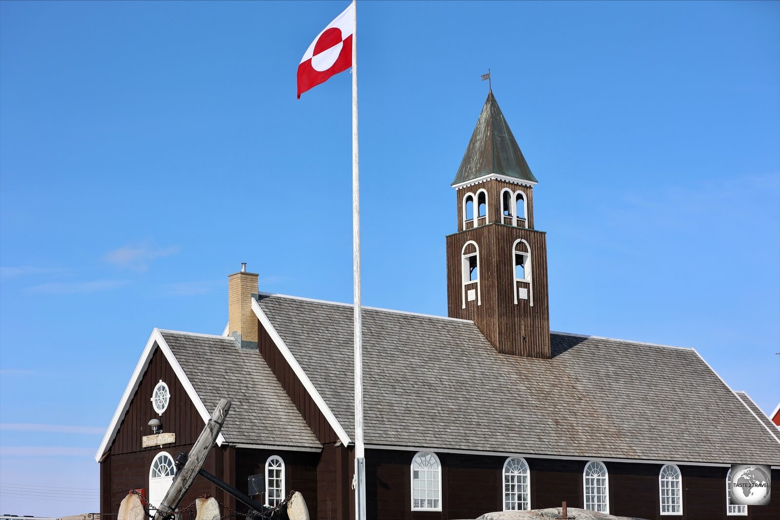 The flag of Greenland flying alongside Zion's church in Ilulissat. 