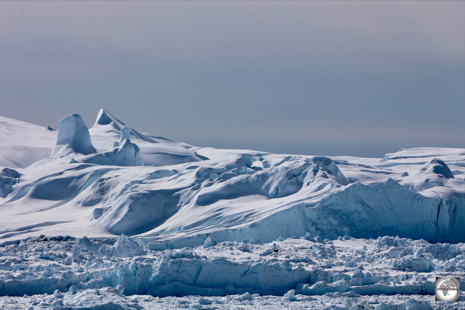 Icebergs on top of icebergs! The larger icebergs block the mouth of the Icefjord, resulting in an iceberg traffic jam! 