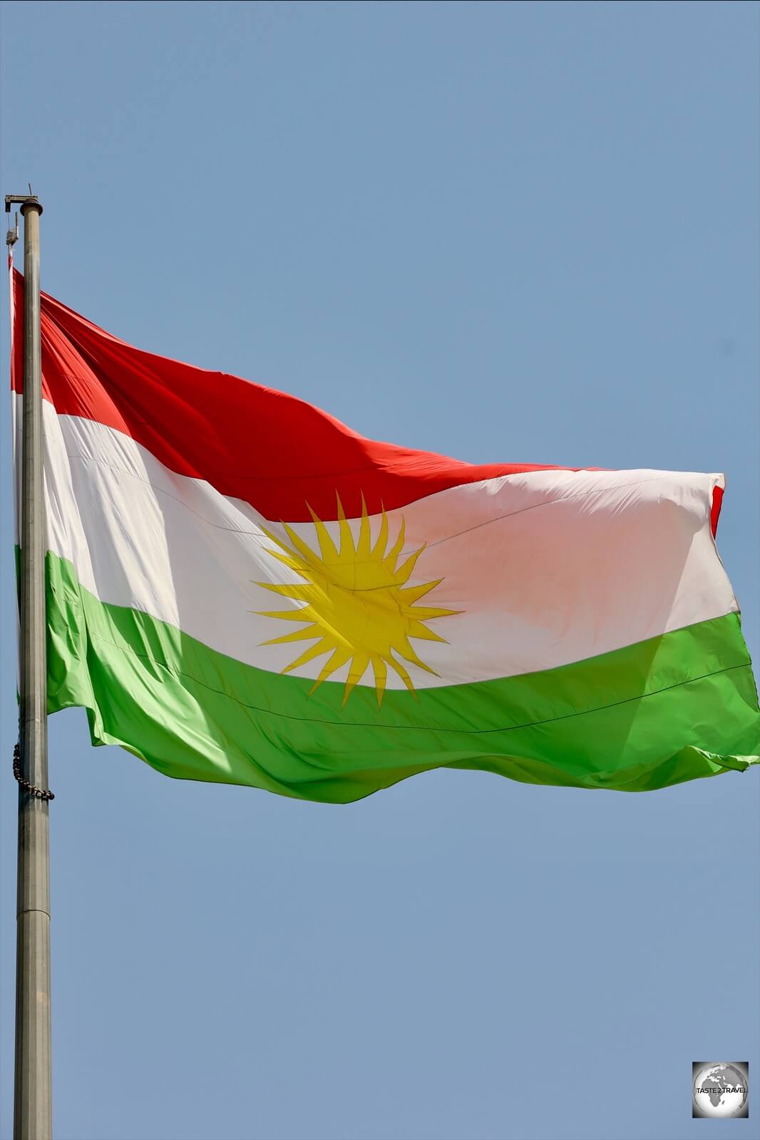 The flag of Kurdistan, flying over Erbil citadel. 