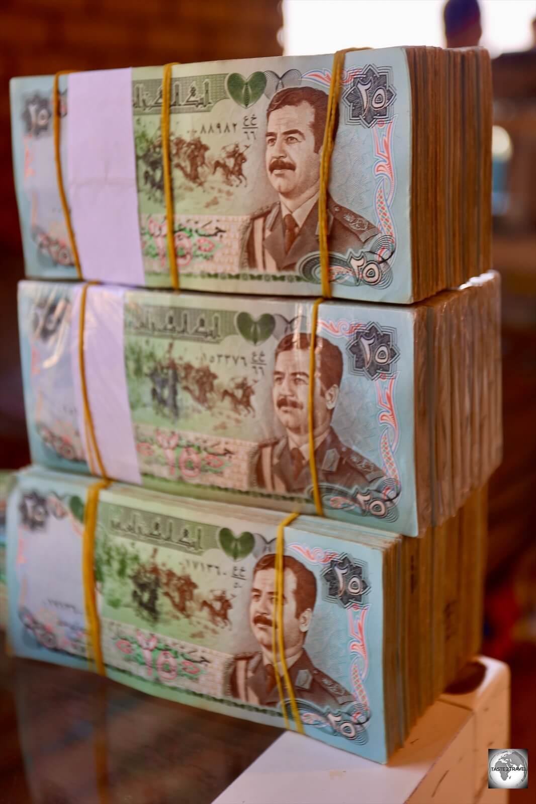 Wads of Saddam Hussein diners at a money exchange in Erbil souk. 