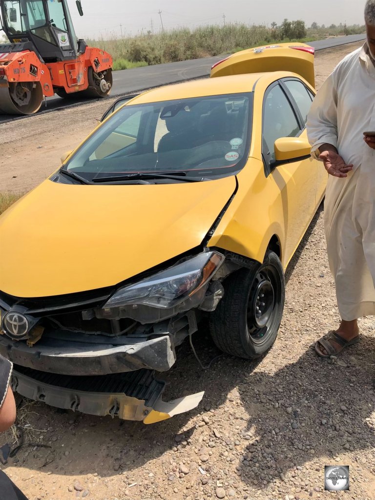 Our damaged taxi, after it was slammed by two runaway tyres on the road to Samarra..